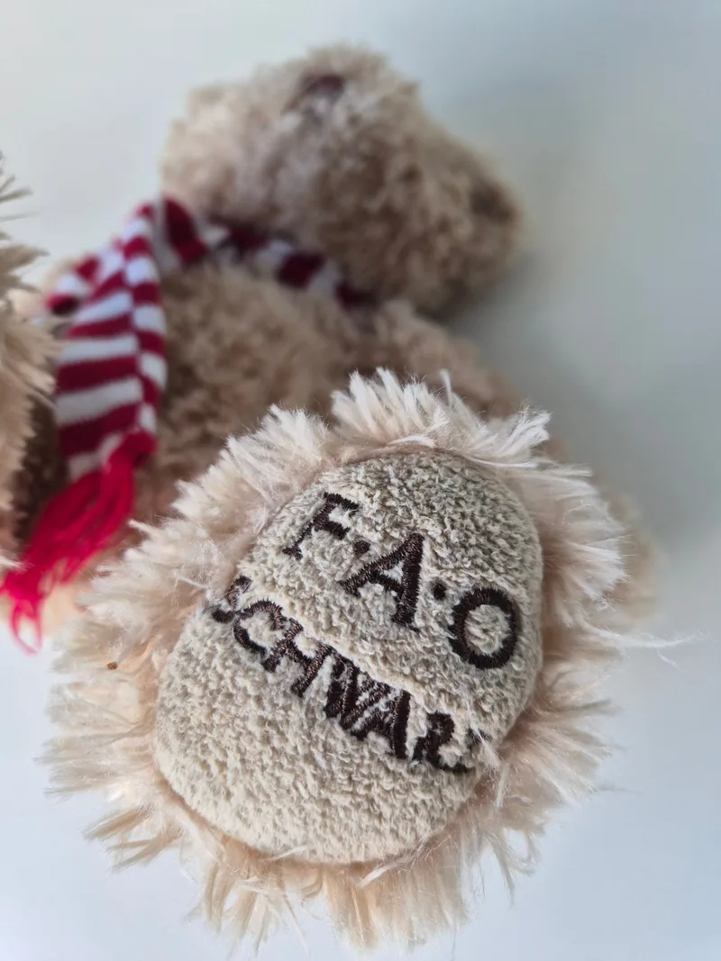 Close-up of the bear's foot pad embroidered with F·A·O SCHWARZ in brown thread