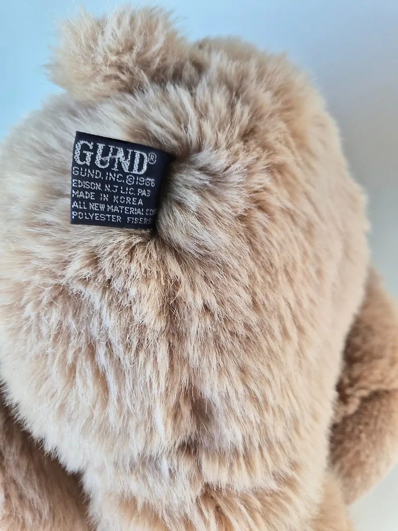 Close-up of the navy Gund seam tag reading Gund Inc. 1986, Made in Korea, all new polyester fibers
